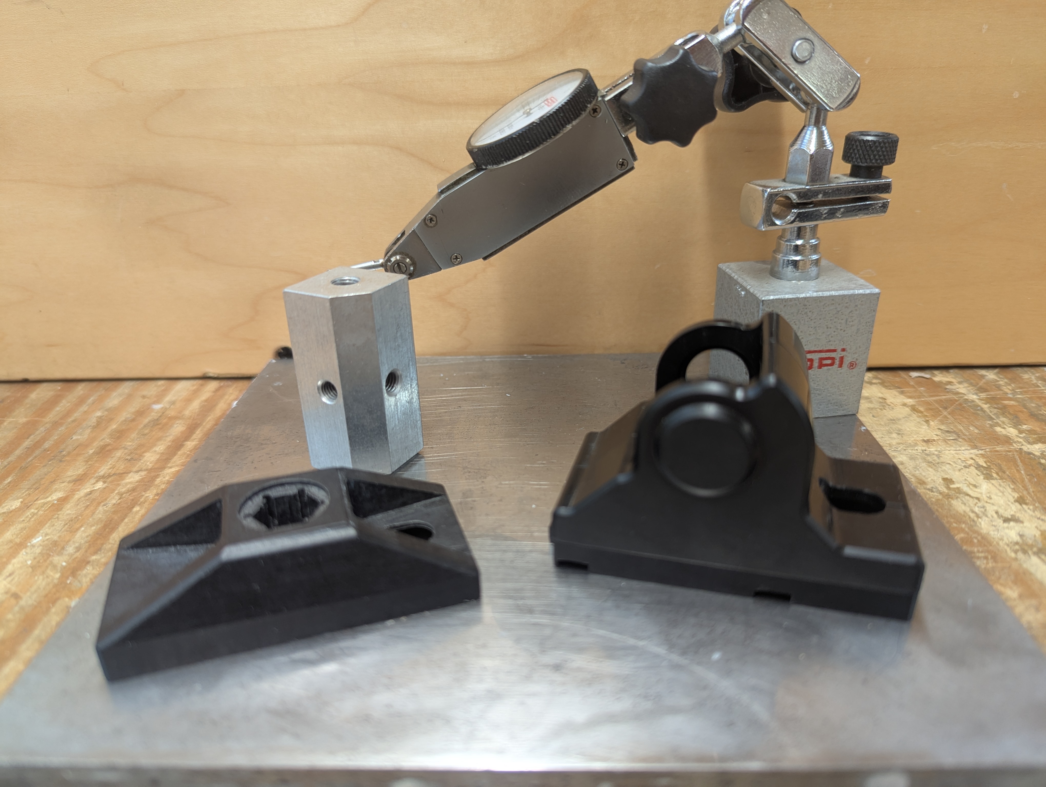 Machined Parts and Dial Indicator